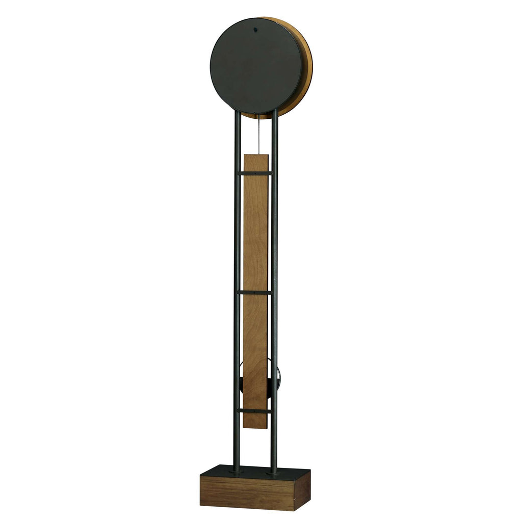 Modern wall clock with a circular face and wooden accents, featuring a minimalist design.