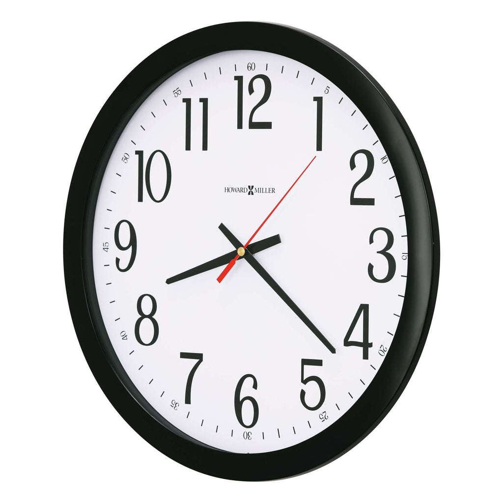 A circular wall clock with black frame and white face displaying numbers and clock hands.