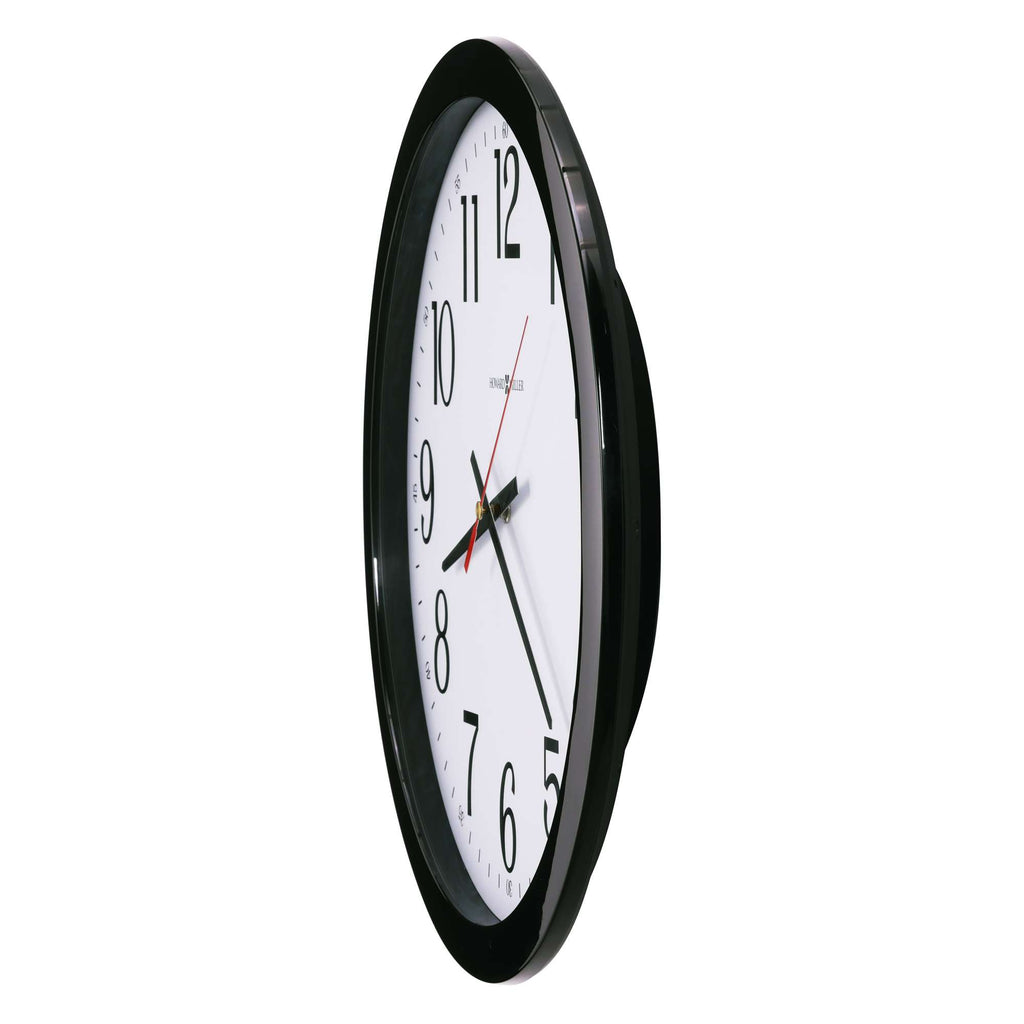 Wall clock with black frame and white face showing the time.