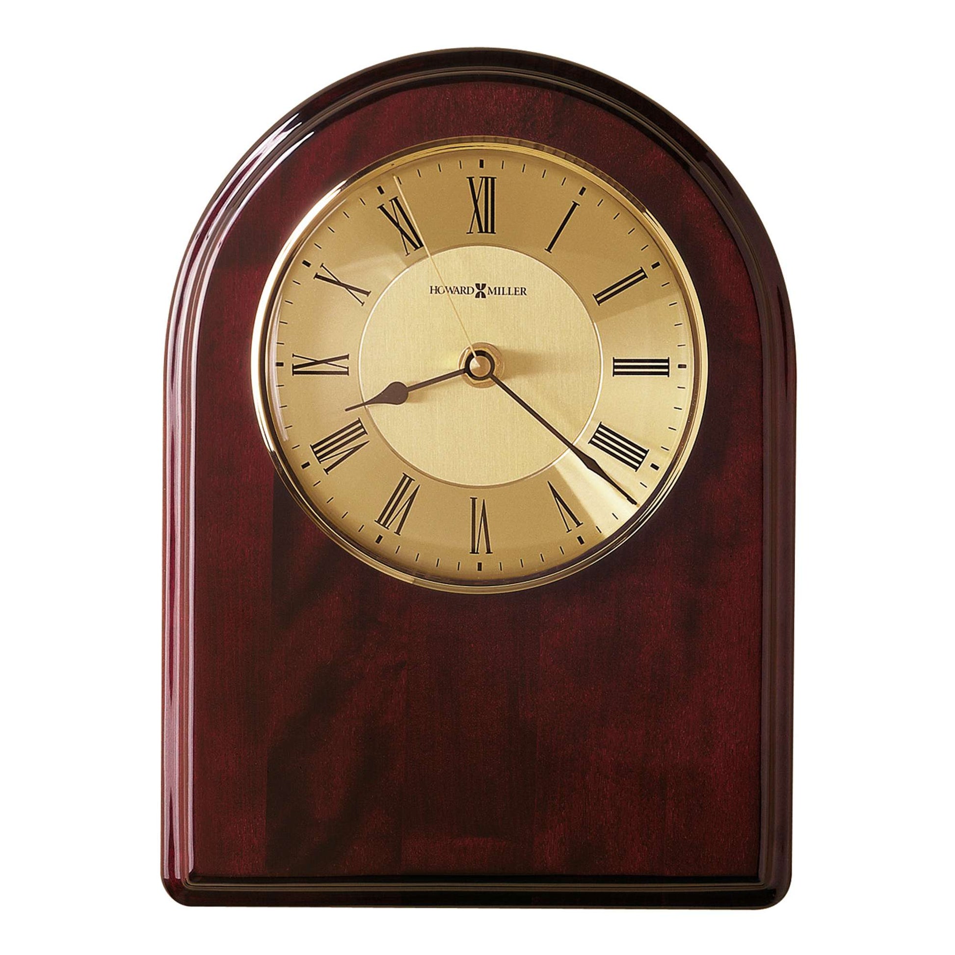 A polished wooden clock with a gold face and Roman numerals.