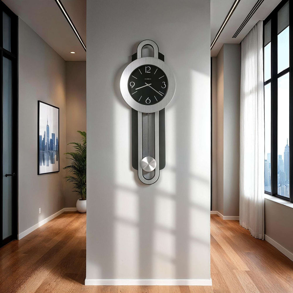 A modern wall clock with a sleek design mounted on a light-colored wall in a well-lit room.
