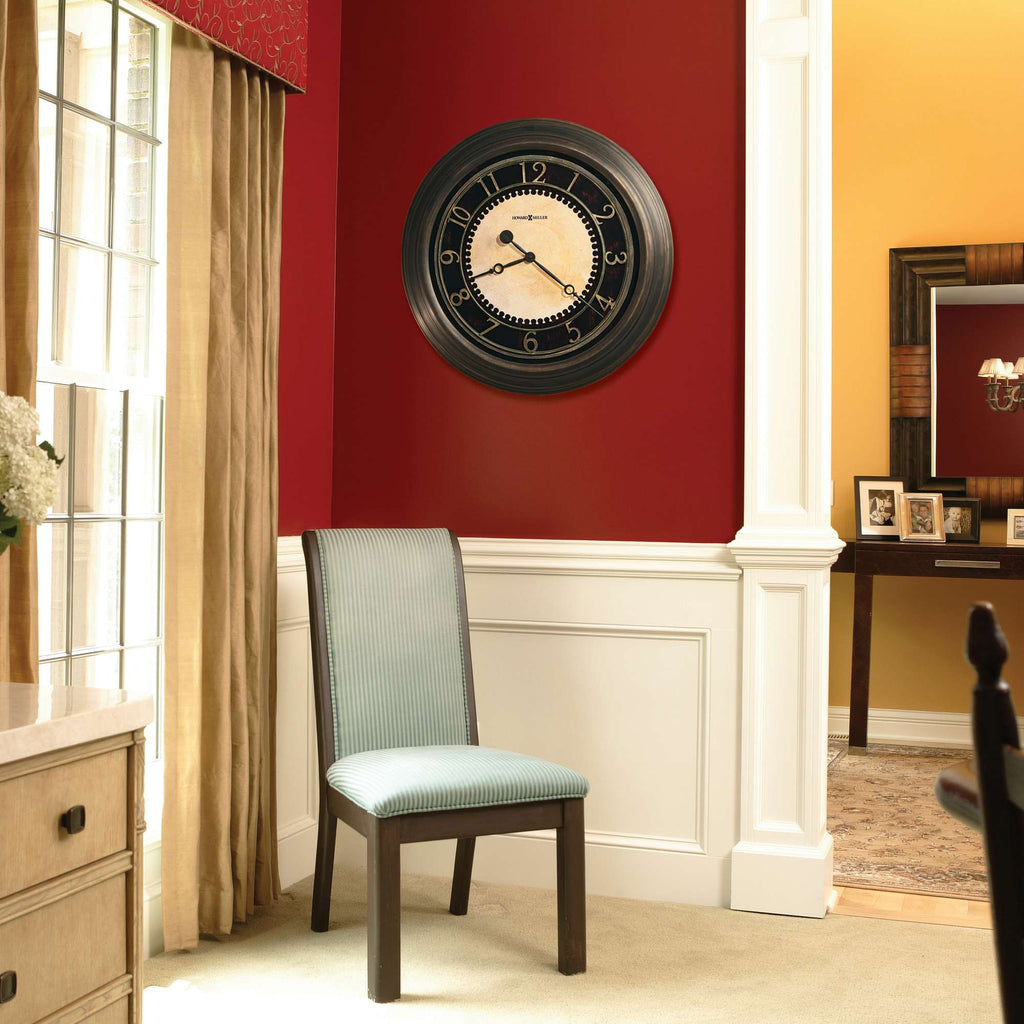 A modern chair next to a wall with a round wall clock and elegant window drapes.