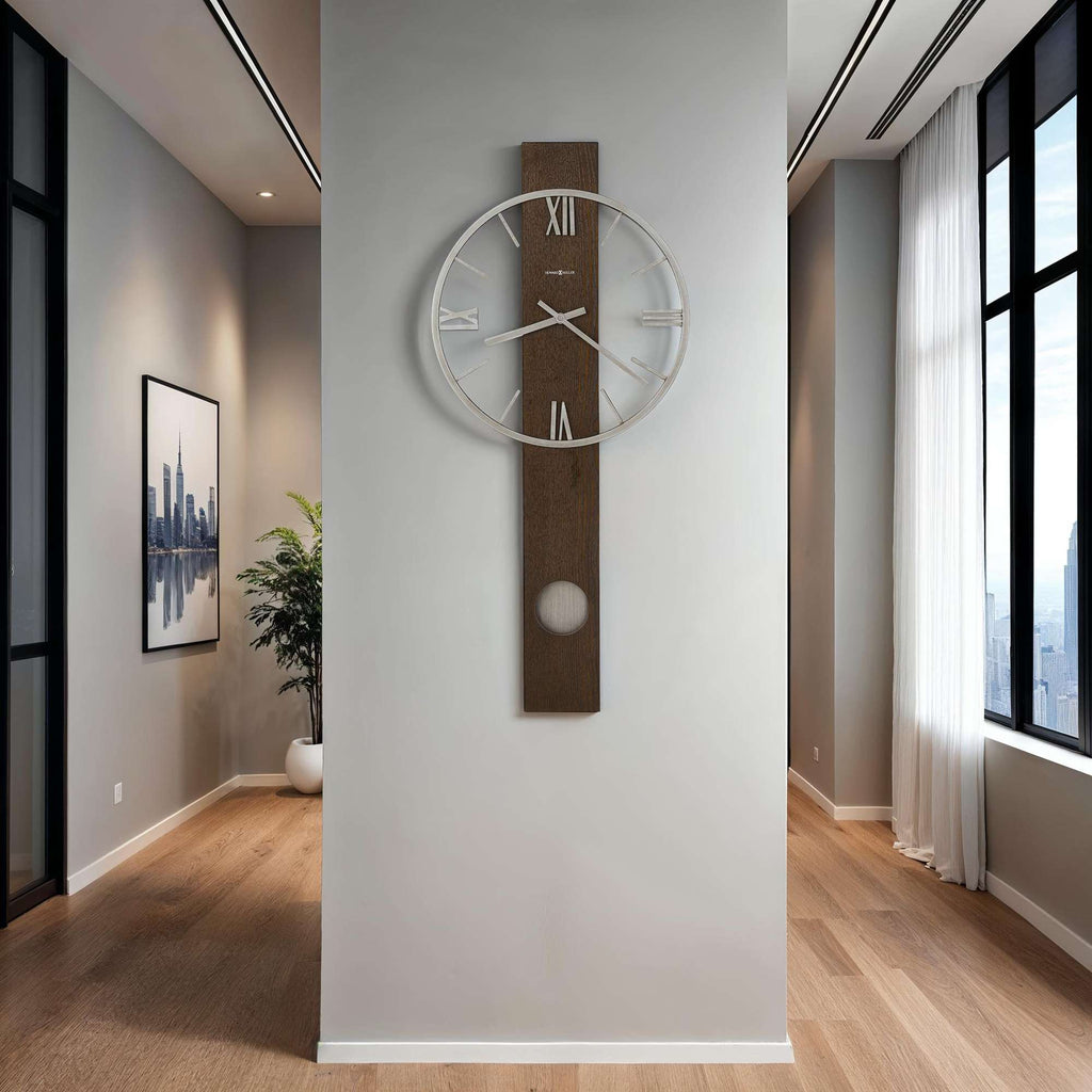 Modern wall clock mounted on a light-colored wall in a contemporary interior space.