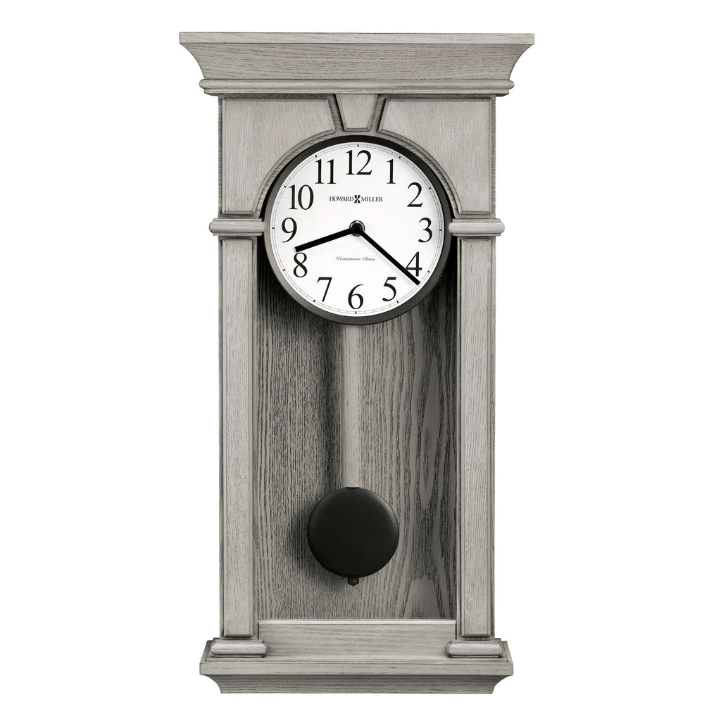 A classic wall clock with a round face and pendulum, set in a grey wooden frame.