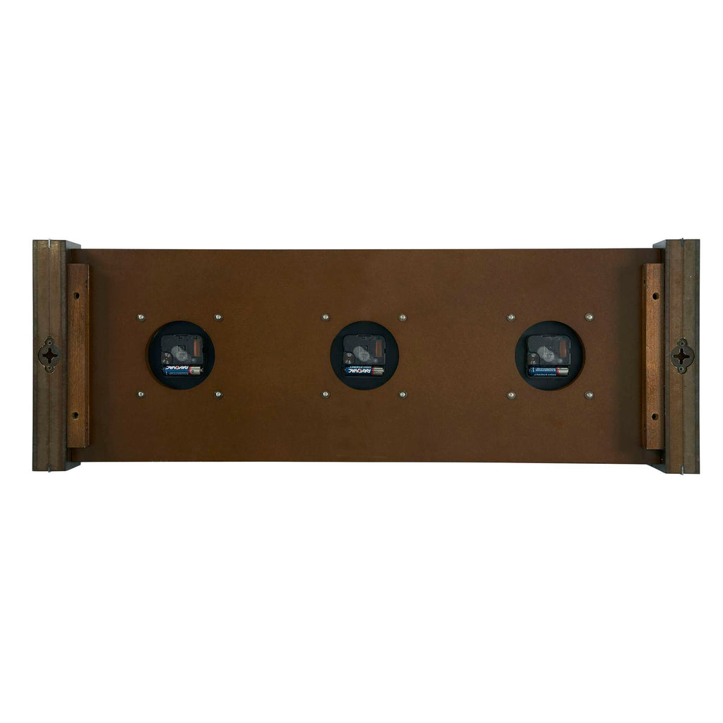 A wooden panel with three round gauges mounted on it.