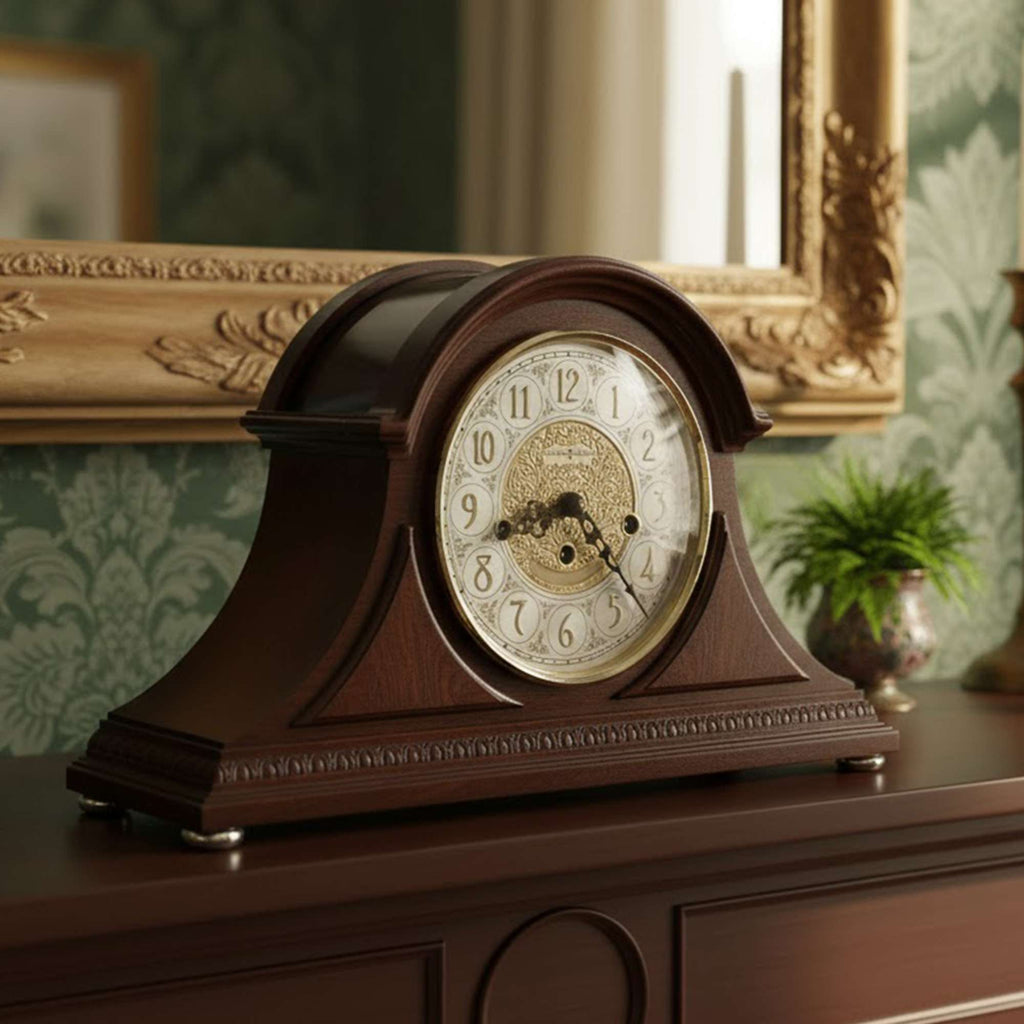 Antique wooden mantel clock with a gold dial