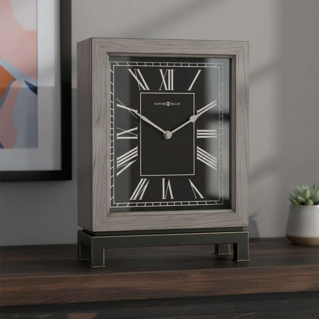 A stylish mantel clock with Roman numerals and a wooden finish on a table.