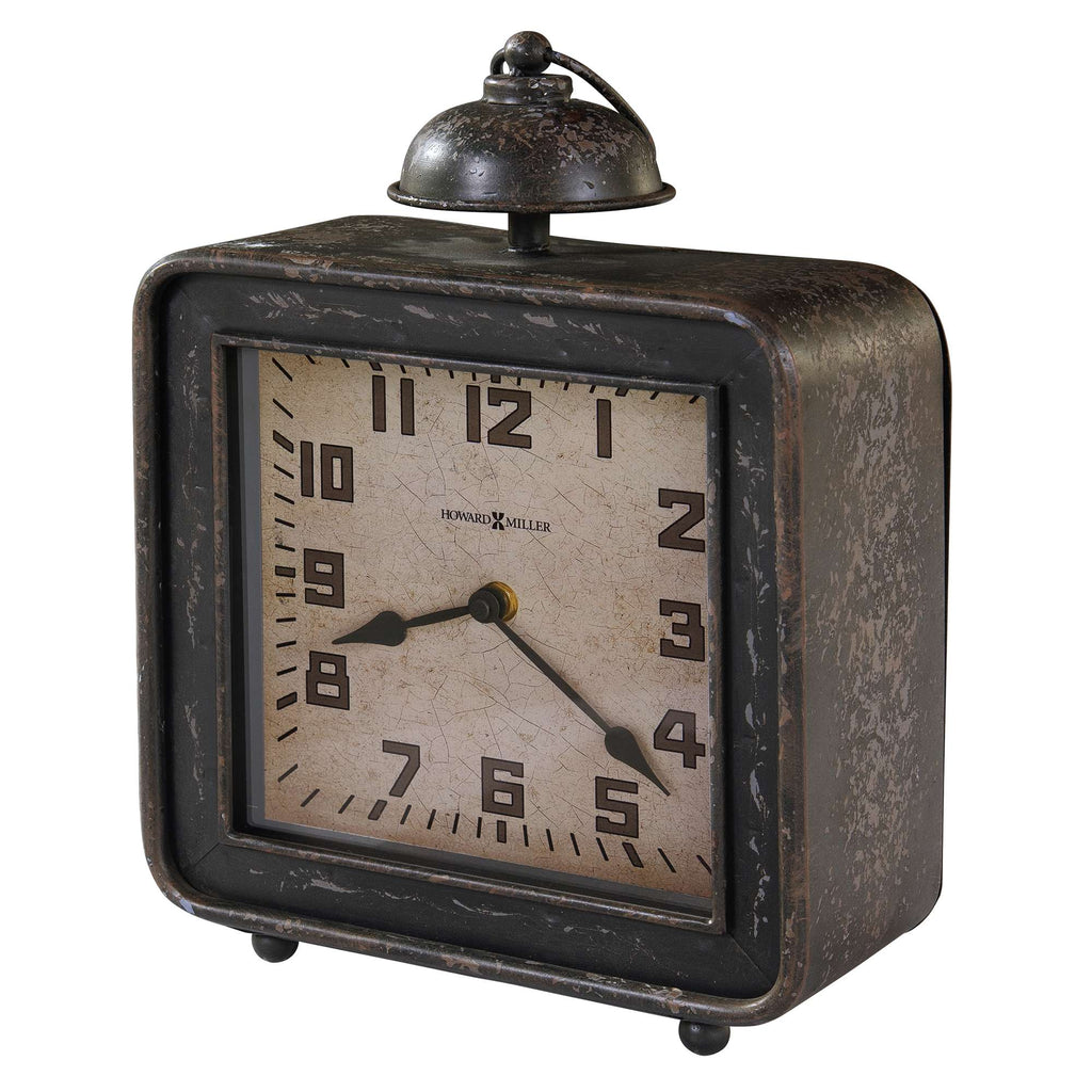 Vintage square alarm clock with a bell on top and a worn bronze finish.