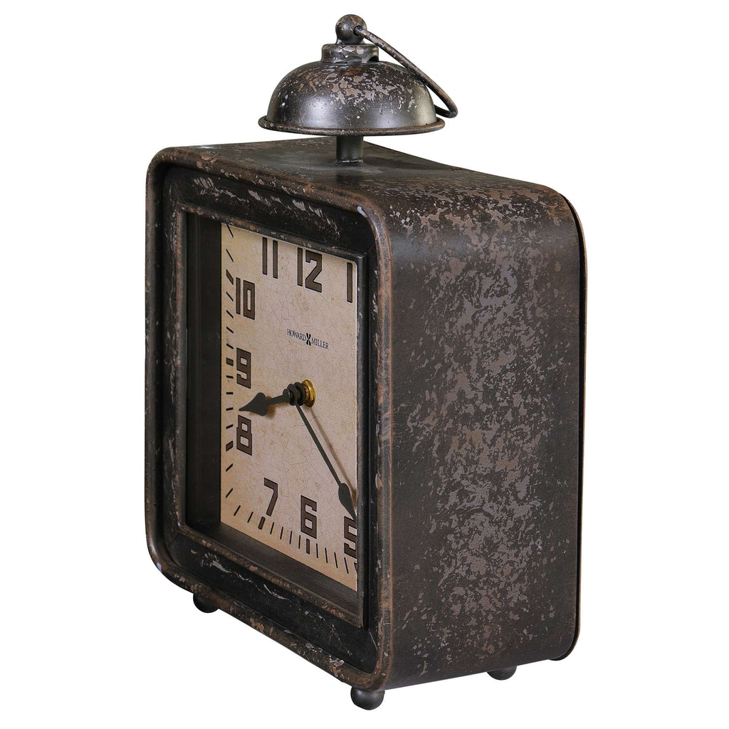 Vintage alarm clock with a rectangular metal frame and a bell on top.
