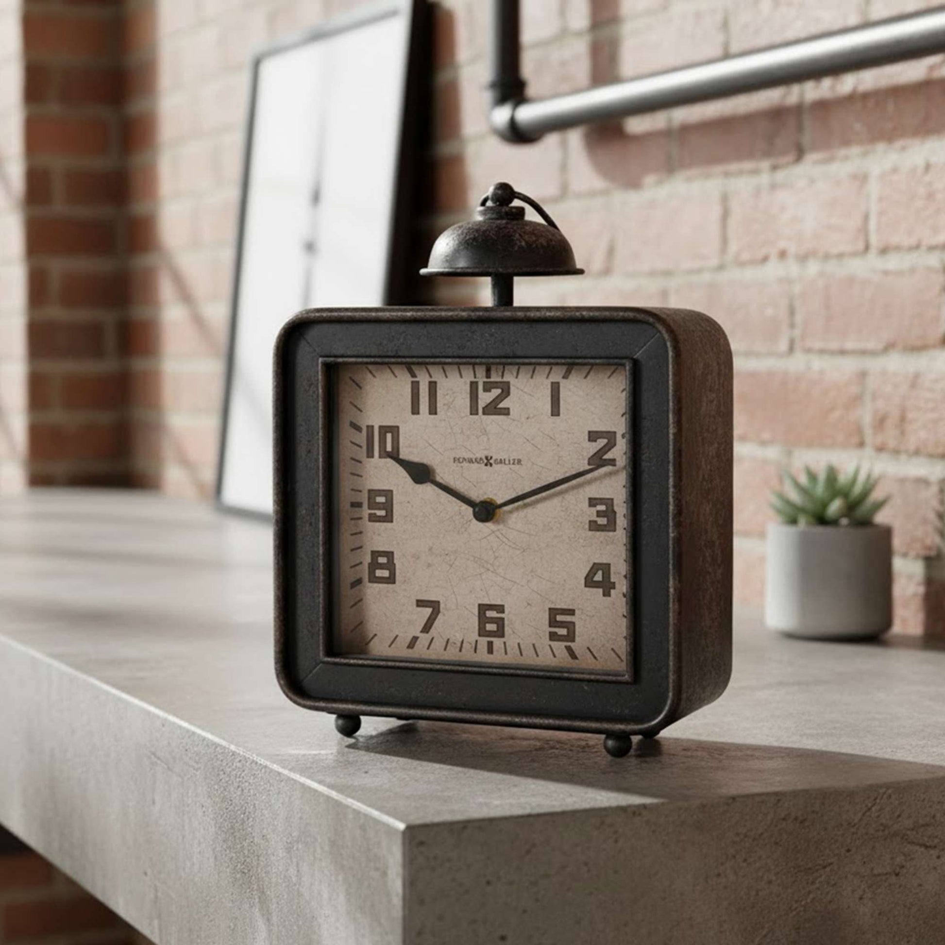 A vintage-style alarm clock sits on a concrete shelf next to a small potted plant.
