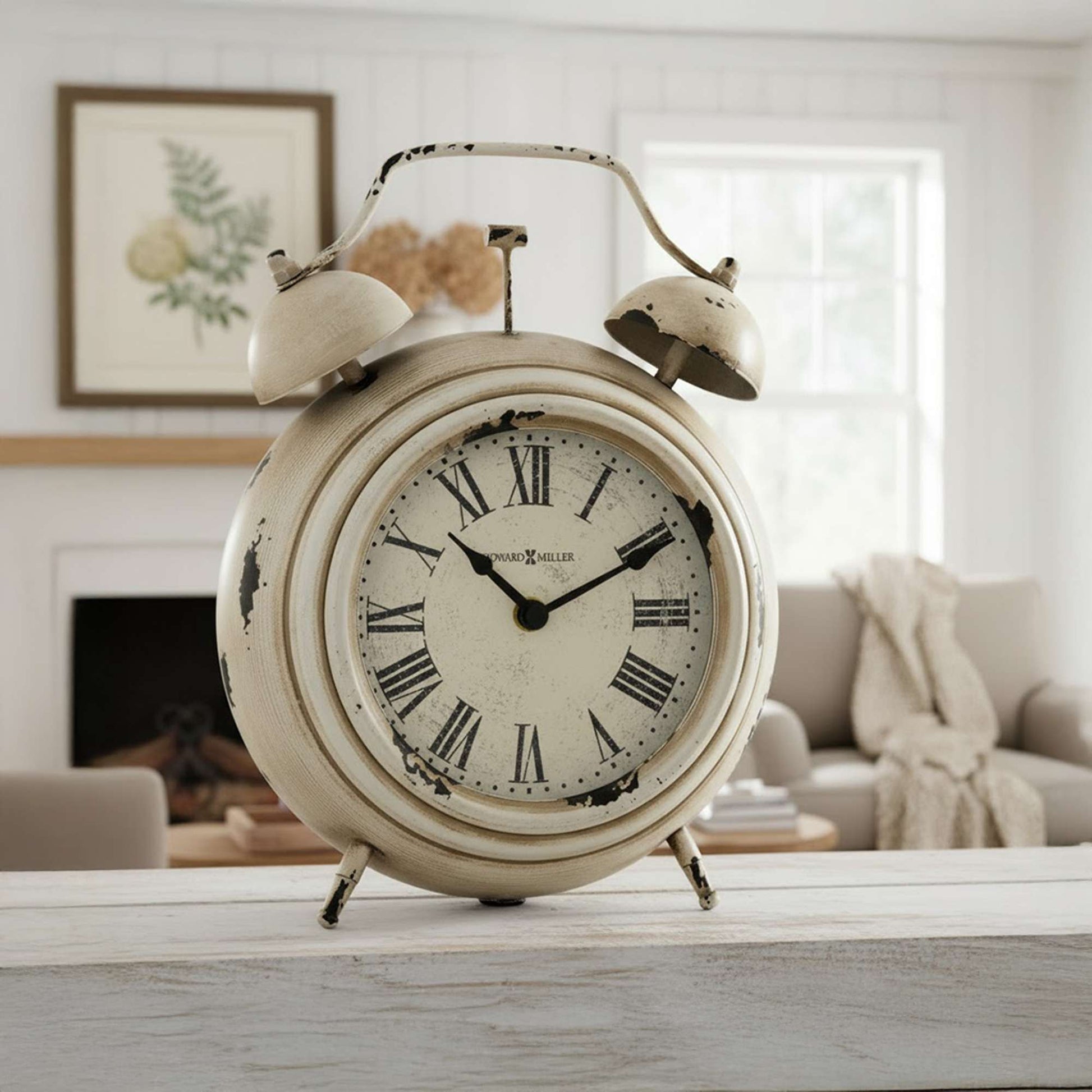 Vintage alarm clock with Roman numerals placed on a wooden table in a cozy living room setting.