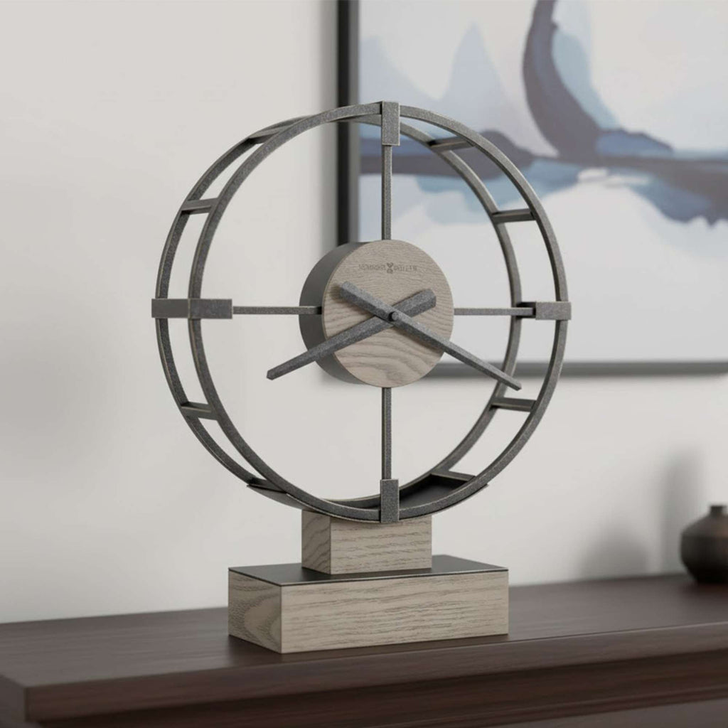 Modern decorative clock with a circular metal frame on a wooden base.