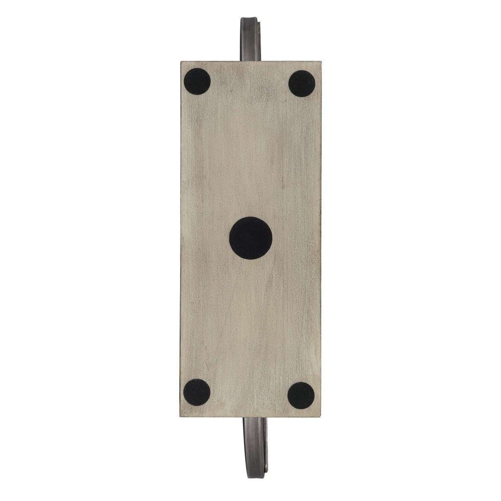 Top view of a rectangular metal object with circular black dots