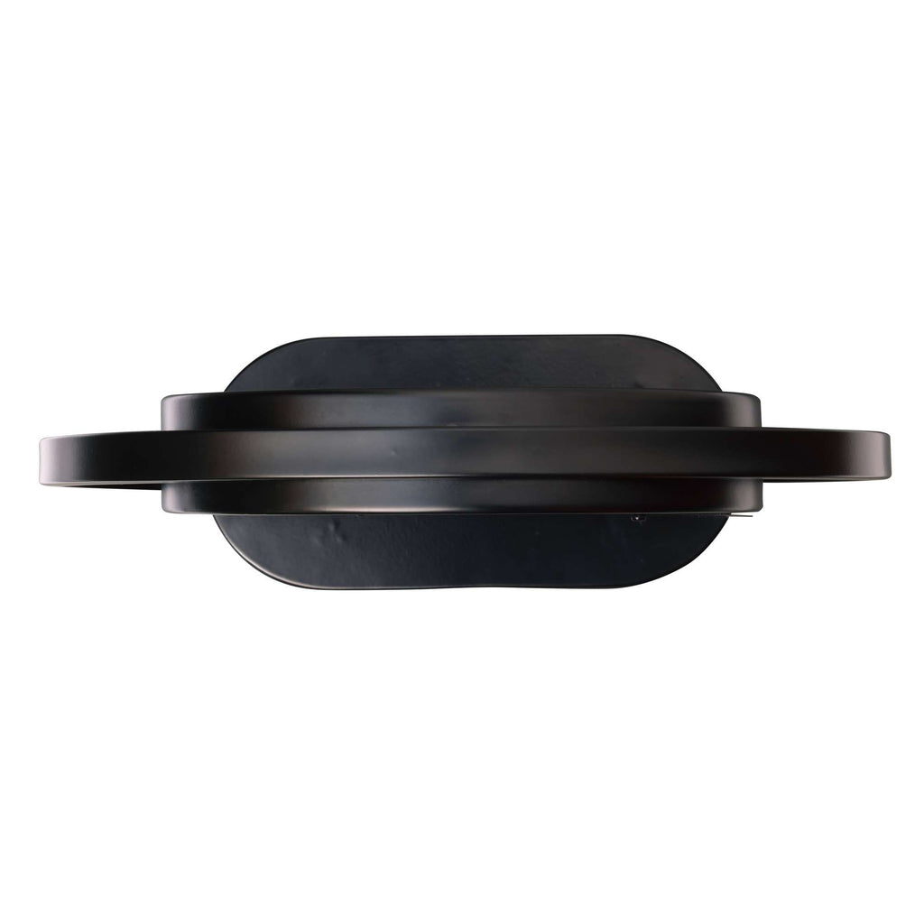 Top view of a black circular object with a flat base and raised edges.