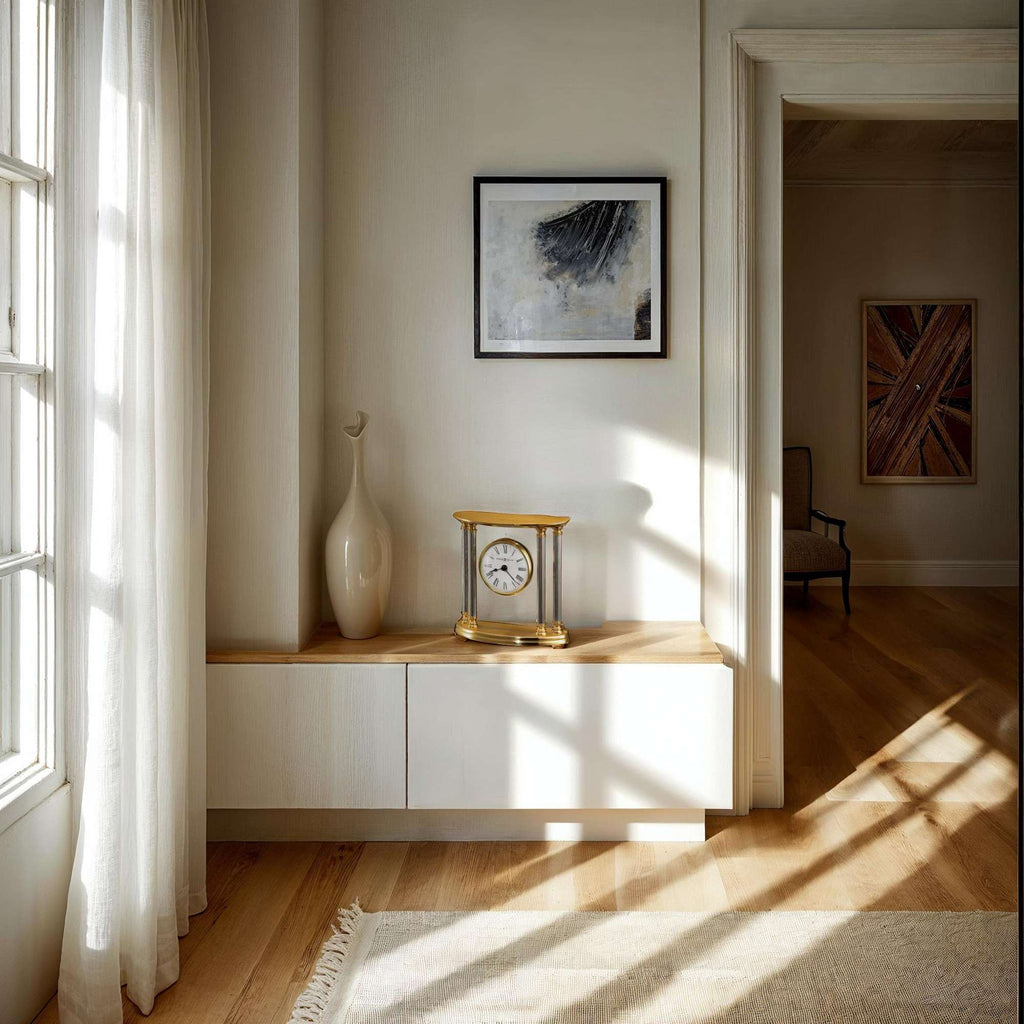 Bright interior space with a clock, vase, and artwork