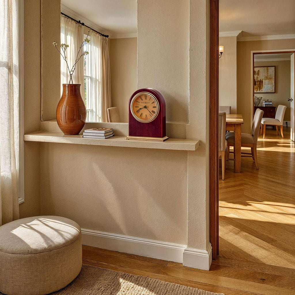 Cozy interior featuring a wooden shelf with a clock, a vase, and a round stool.