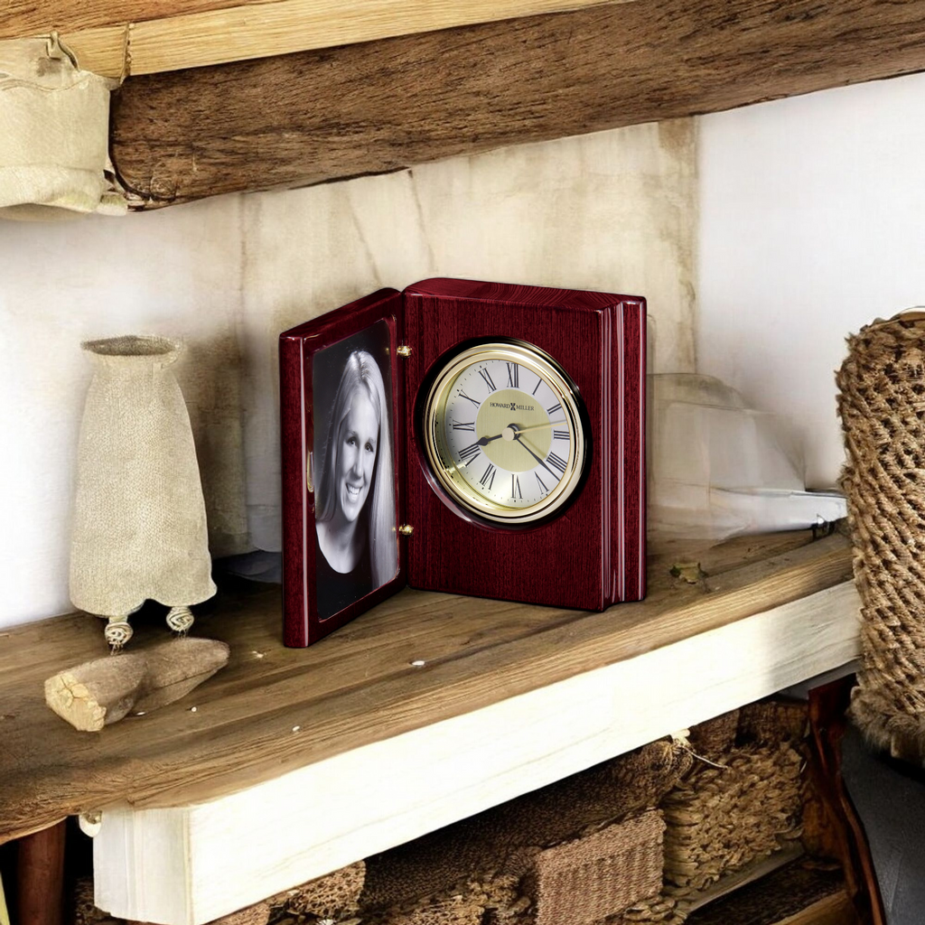 A decorative clock with a photo frame, placed on a rustic wooden shelf.