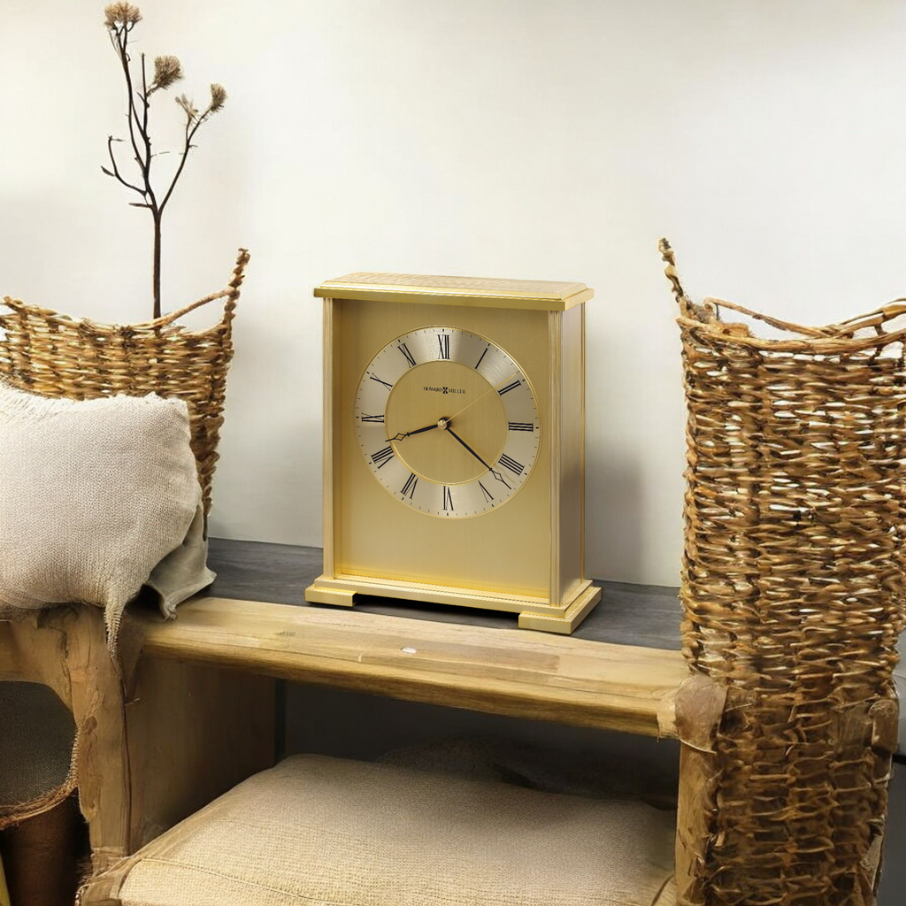 A decorative yellow clock on a wooden table between two woven baskets.