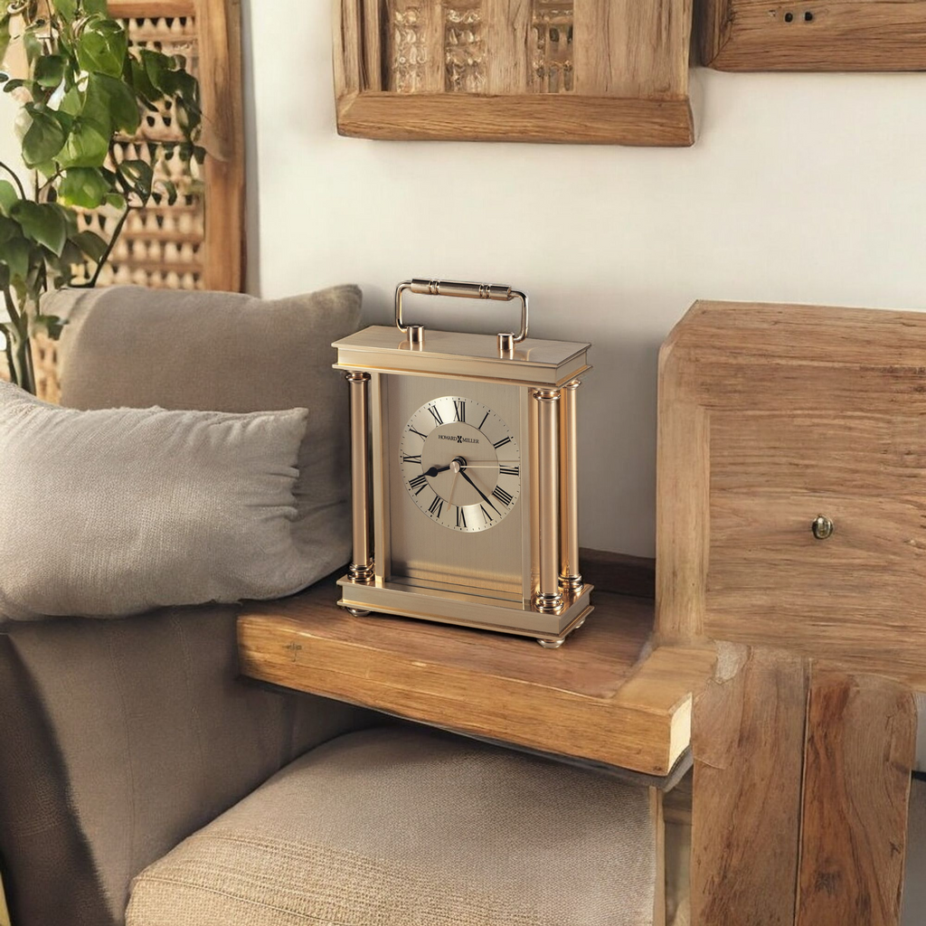 A vintage-style clock on a wooden table beside a cozy sofa.