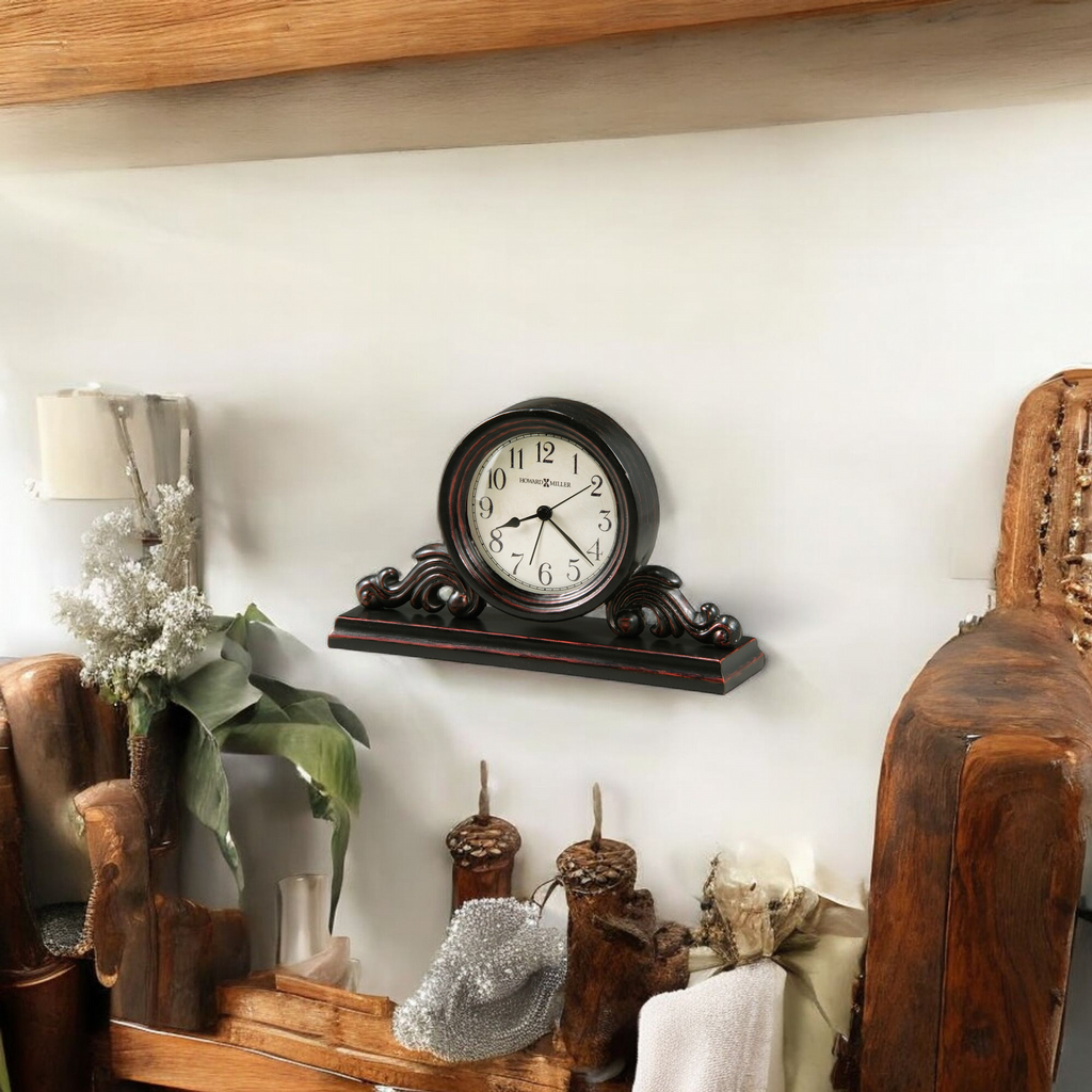 A decorative wall clock on a wooden shelf with plants and decorative items.