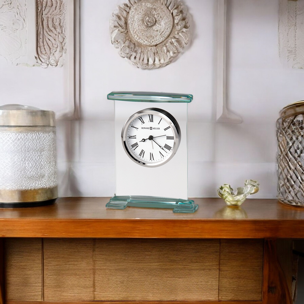 A decorative clock displayed on a wooden table with contemporary decor.