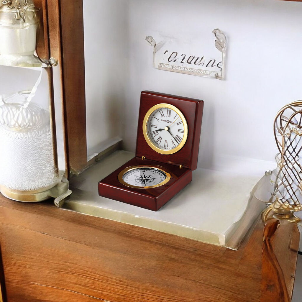 A decorative wooden clock and compass on a shelf.