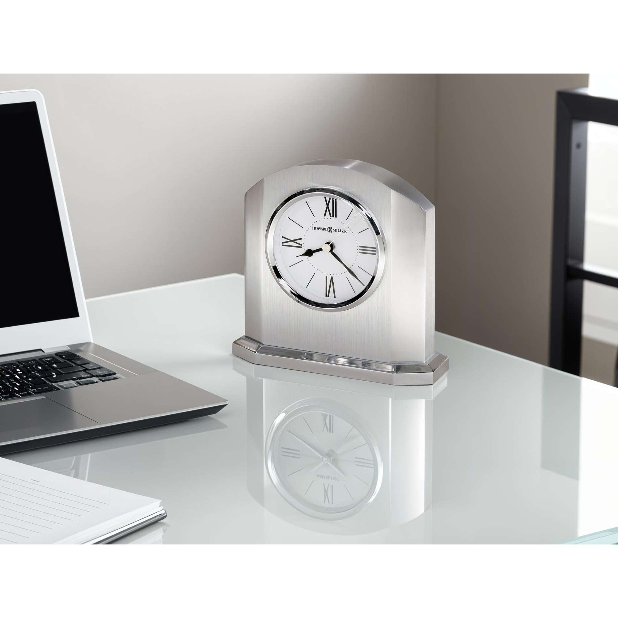Elegant silver desk clock on a modern workspace