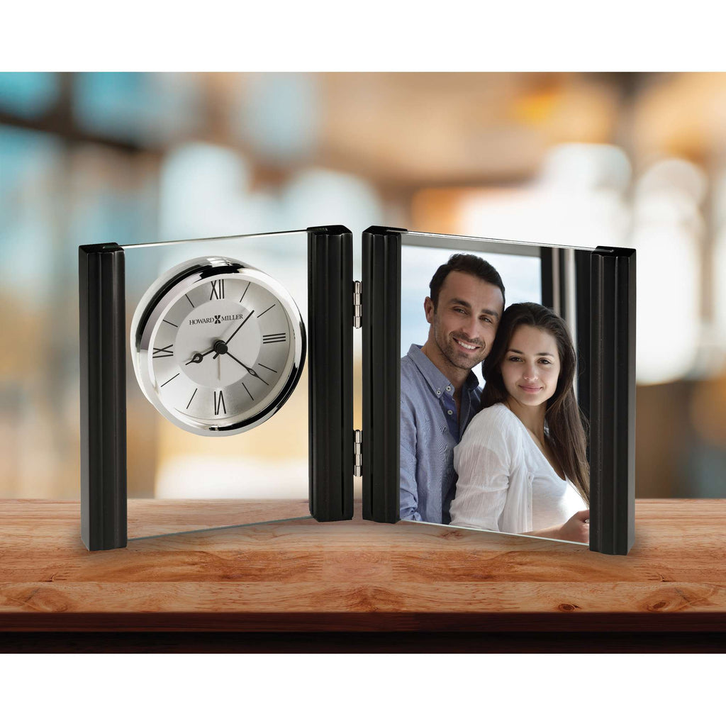 A decorative photo frame featuring a clock and a picture of a smiling couple.