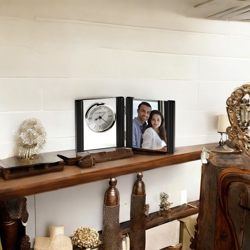A decorative shelf displaying a clock and a picture frame with a couple's photo.