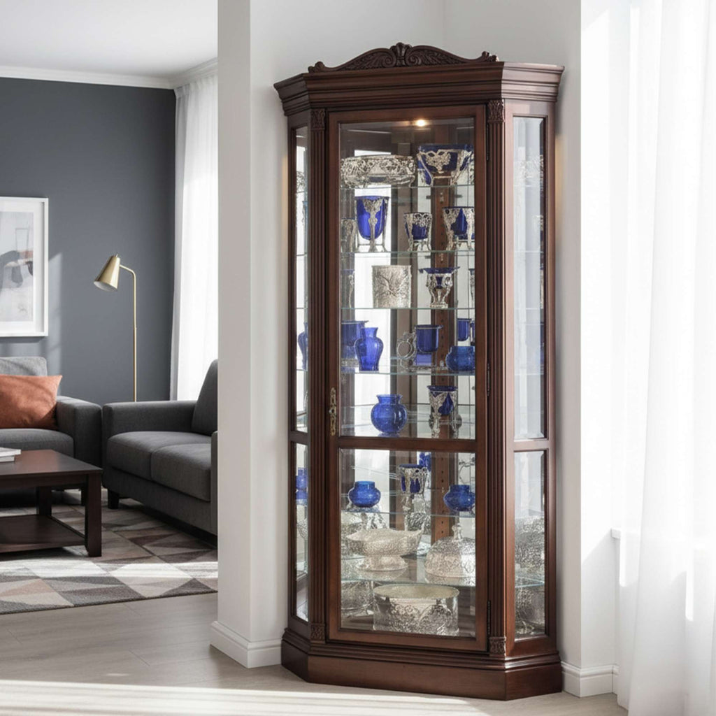 A wooden display cabinet with glass doors showcasing decorative items and blue vases in a modern living room.