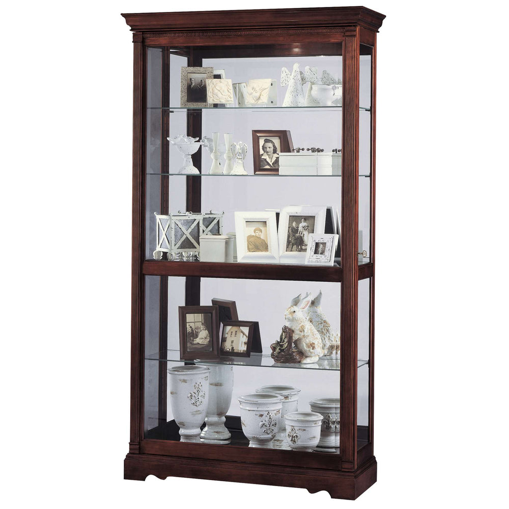 A wooden display cabinet featuring multiple shelves with decorative items, including photo frames and porcelain figurines.