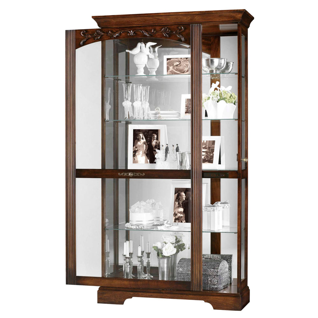 Elegant wooden display cabinet showcasing decorative items and personal photos.