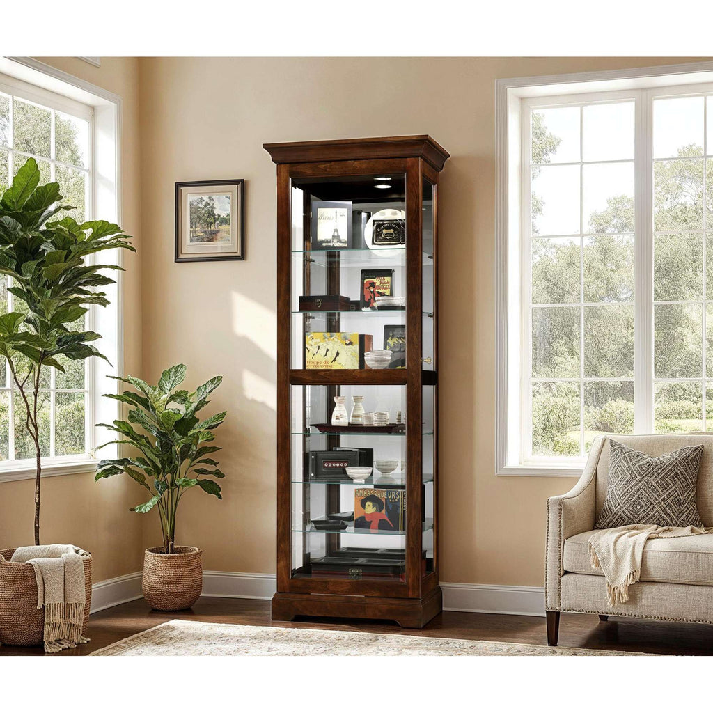A stylish wooden display cabinet with glass shelves in a well-lit living room.