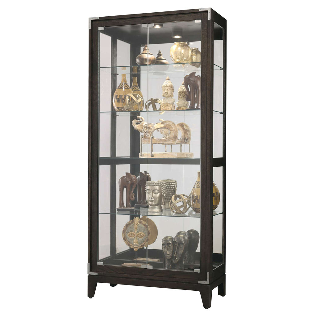 A display cabinet showcasing various decorative artifacts and sculptures.