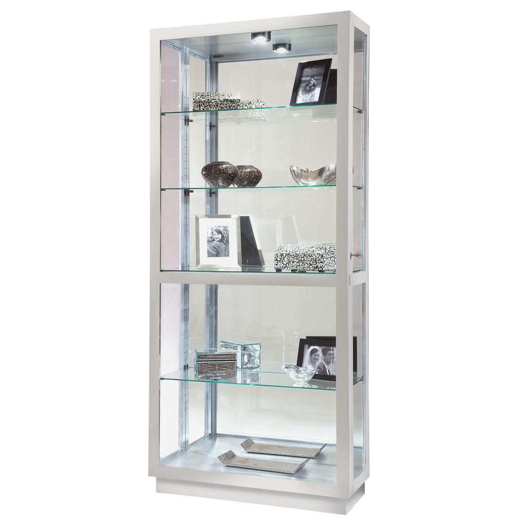 Modern display cabinet with glass shelves showcasing decorative items and picture frames.