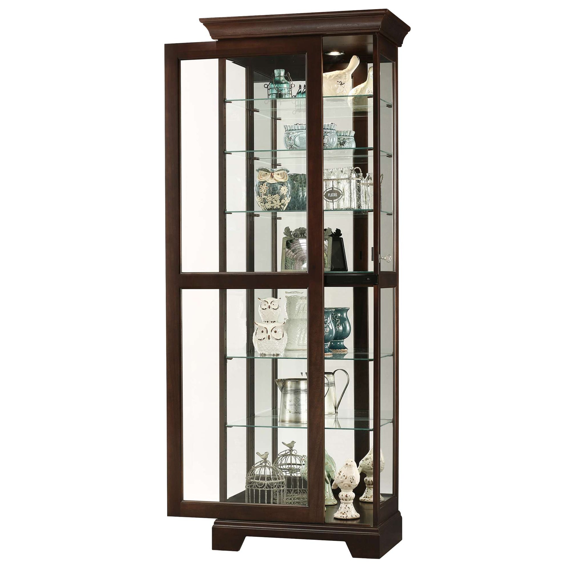 A tall wooden display cabinet with glass shelves showcasing decorative items.