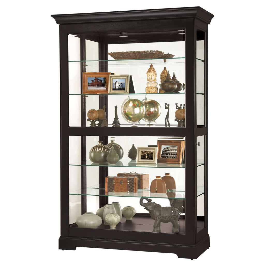 Dark wooden display cabinet with glass shelves showcasing decorative items and photographs.