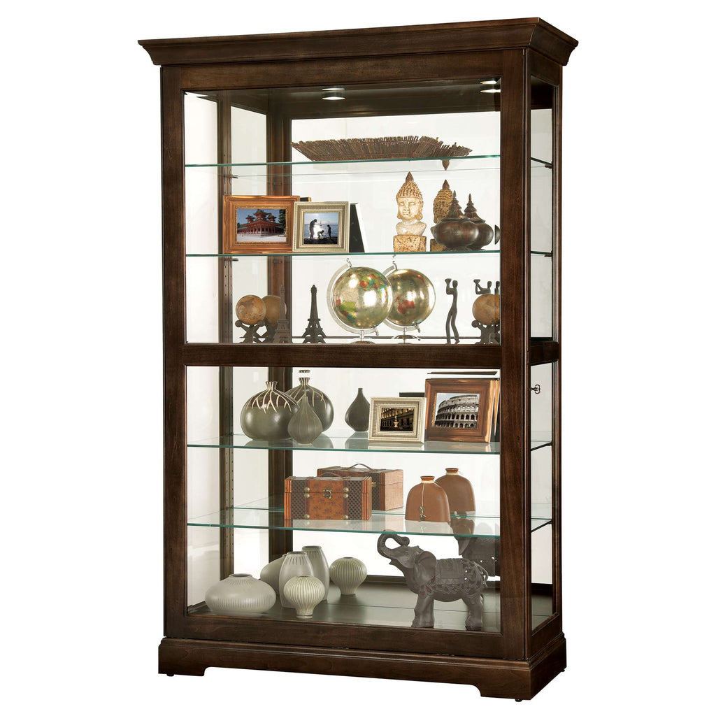 Wooden display cabinet with glass shelves showcasing decorative items and photographs.