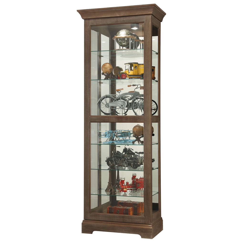 Glass display cabinet showcasing various collectibles and models.