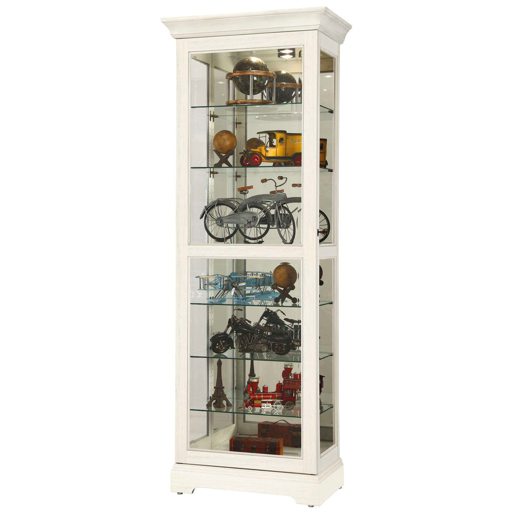A tall, white display cabinet with glass shelves showcasing various collectible models and antiques.