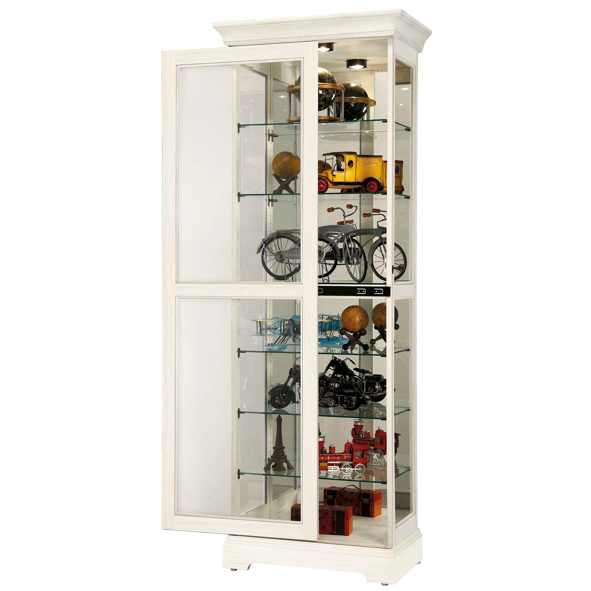 A white display cabinet with glass shelves showcasing various collectibles and decorative items.