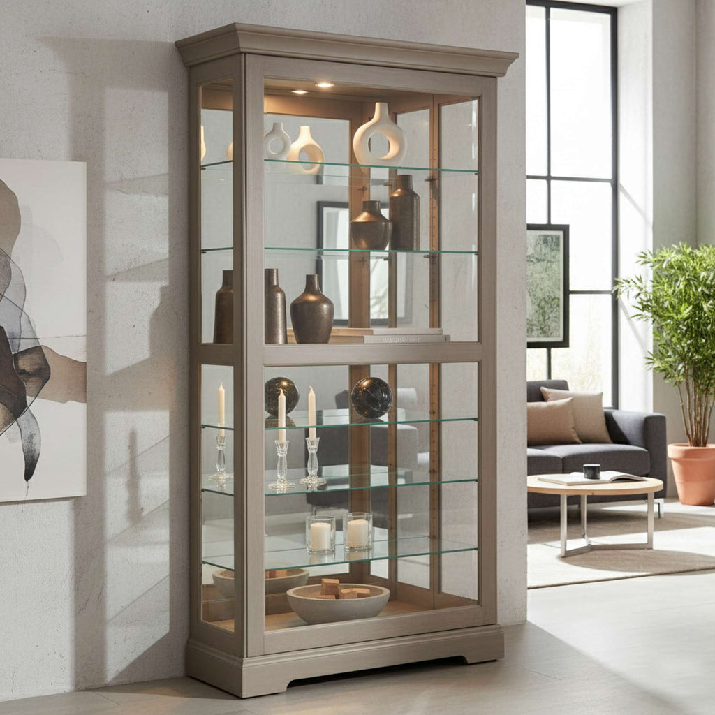 Modern glass display cabinet showcasing decorative items, set in a bright, contemporary living space.