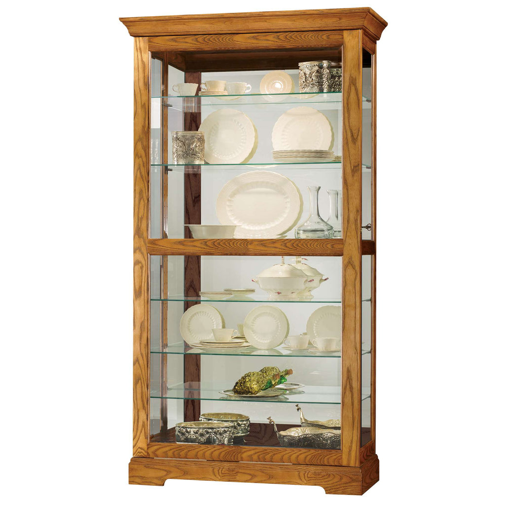 Wooden display cabinet showcasing fine china and decorative items