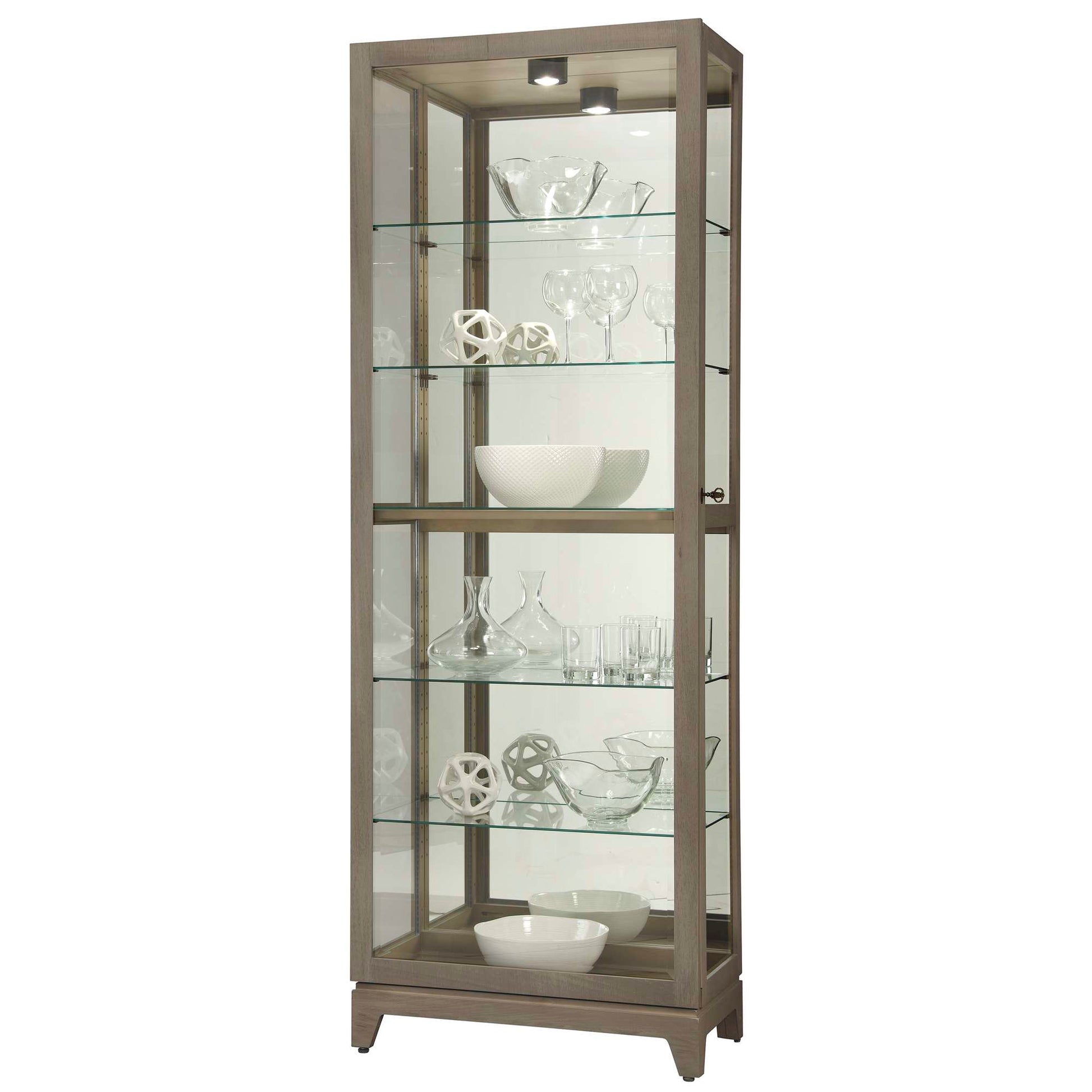 A tall glass display cabinet with decorative glassware and bowls inside.