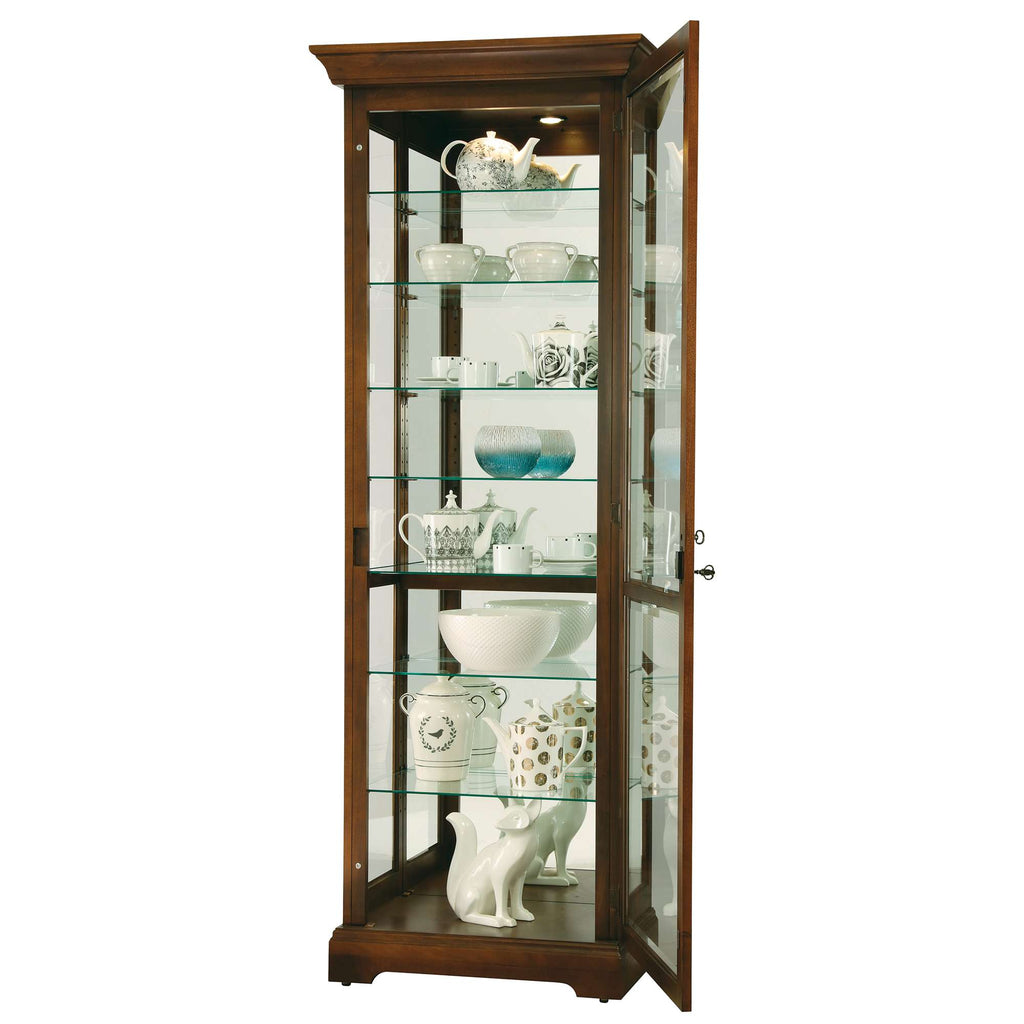 Glass display cabinet showcasing various decorative dishes and figurines