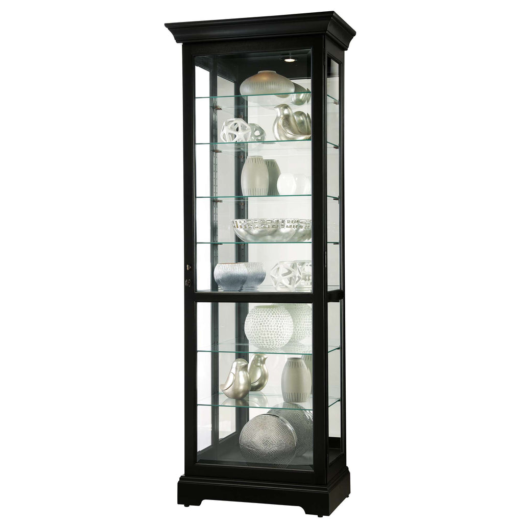 A tall, black display cabinet with glass shelves showcasing decorative objects.