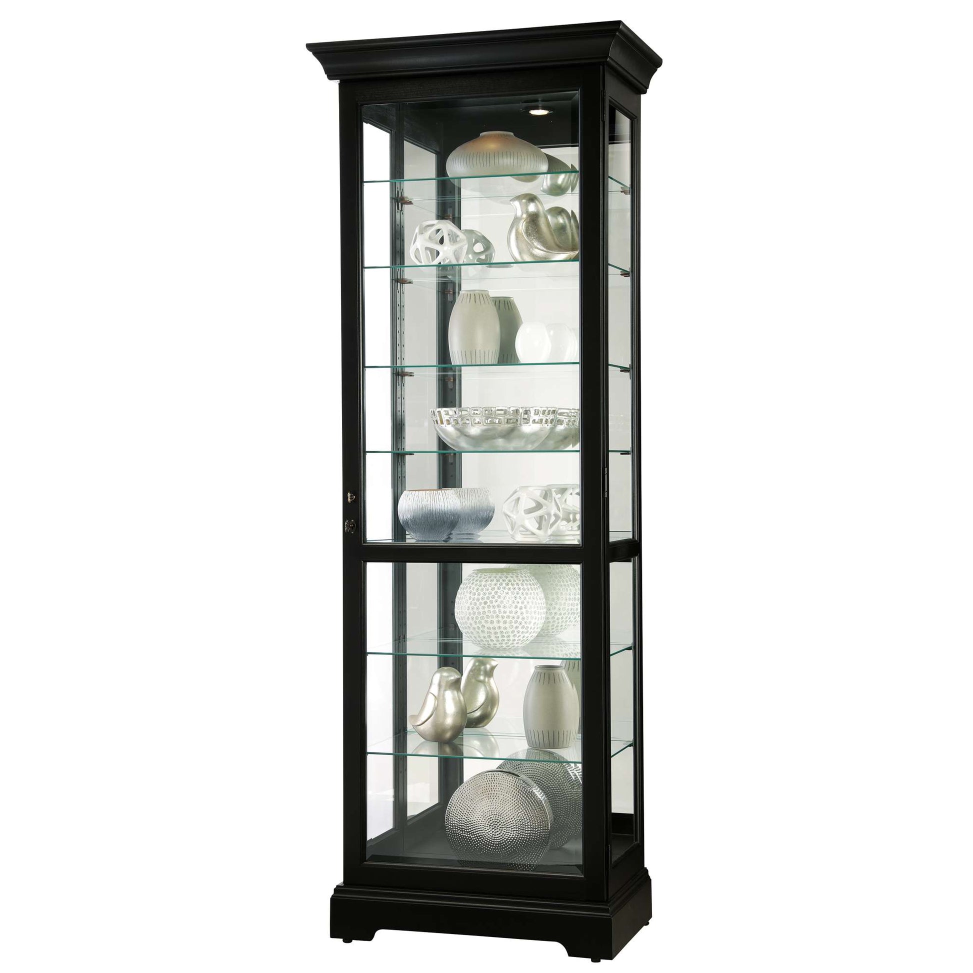 A tall, black display cabinet with glass shelves showcasing decorative objects.