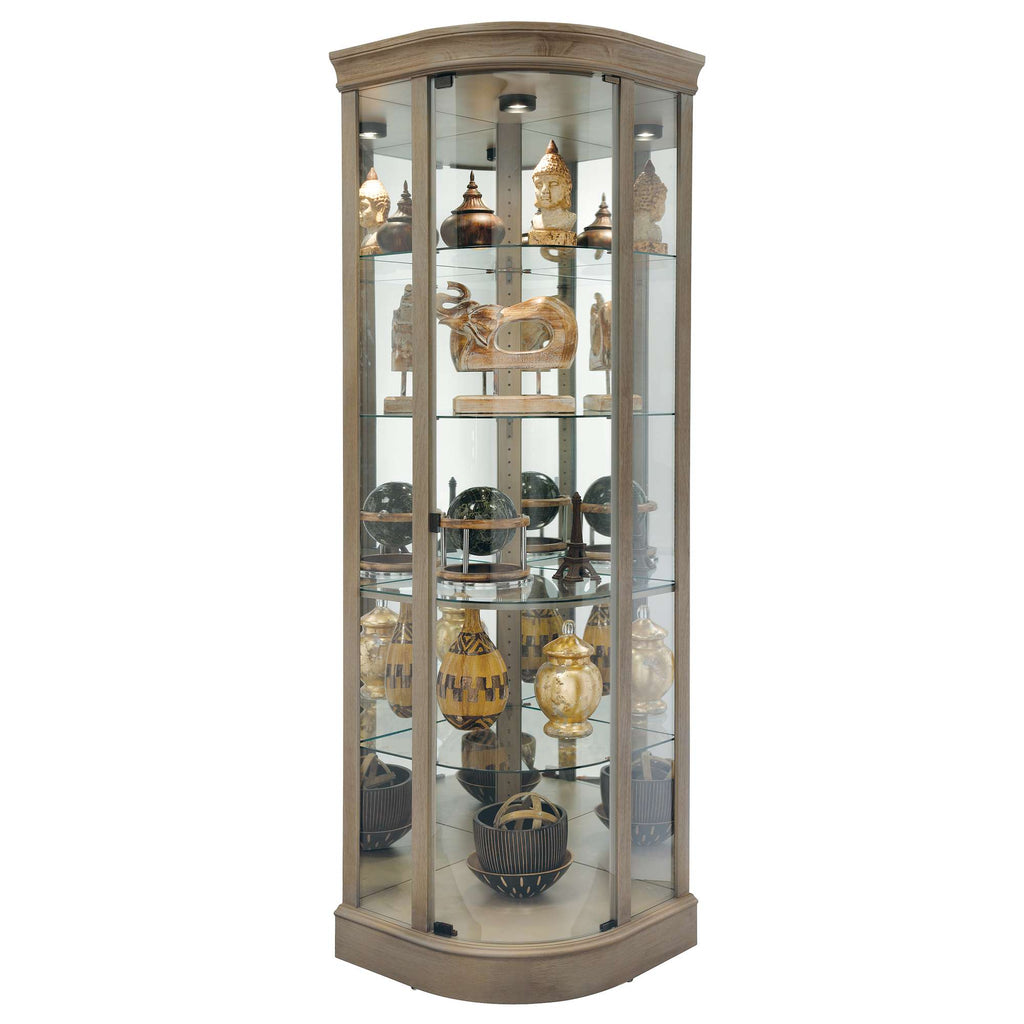 A glass display cabinet showcasing various decorative items and collectibles.