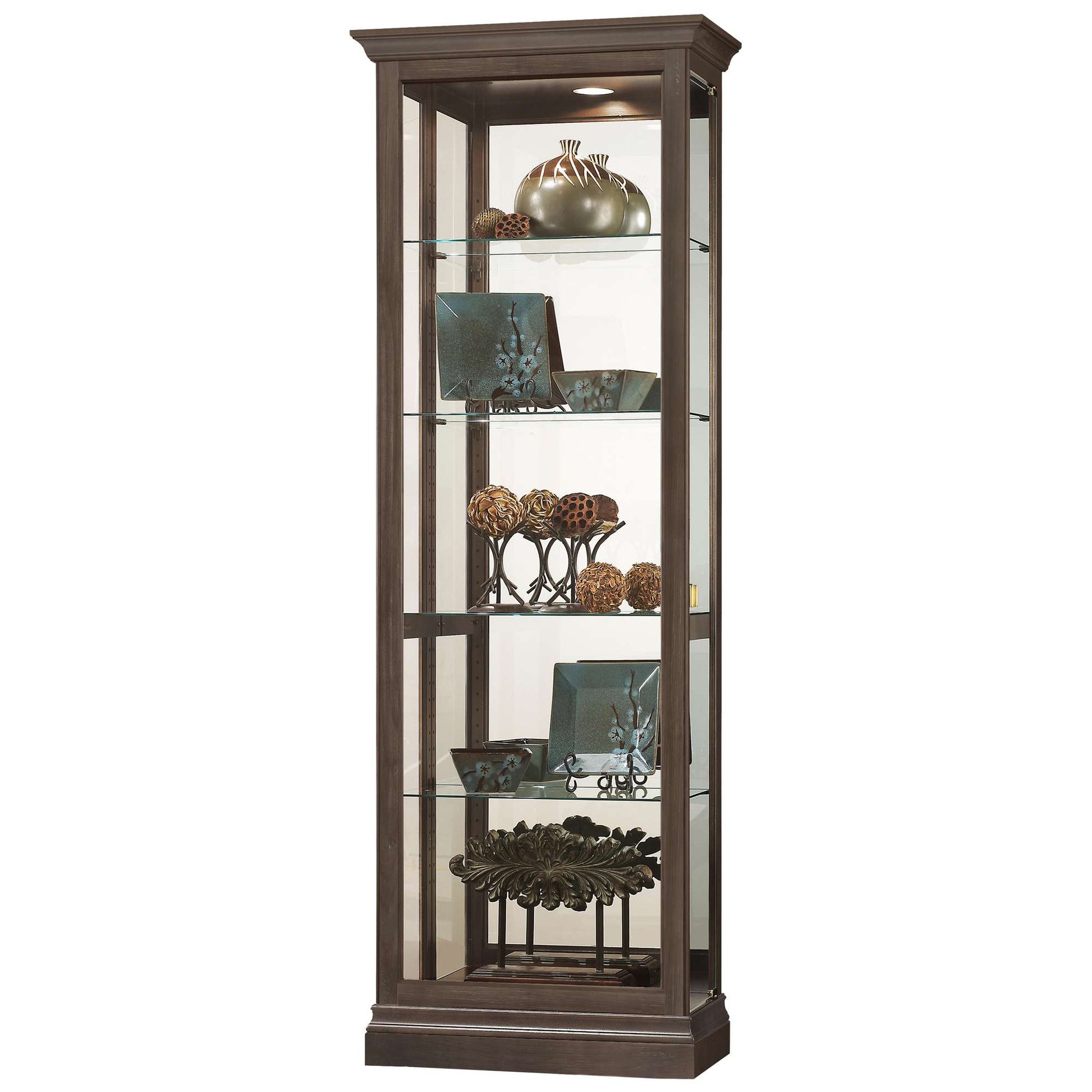 Tall glass display cabinet with decorative items and shelves