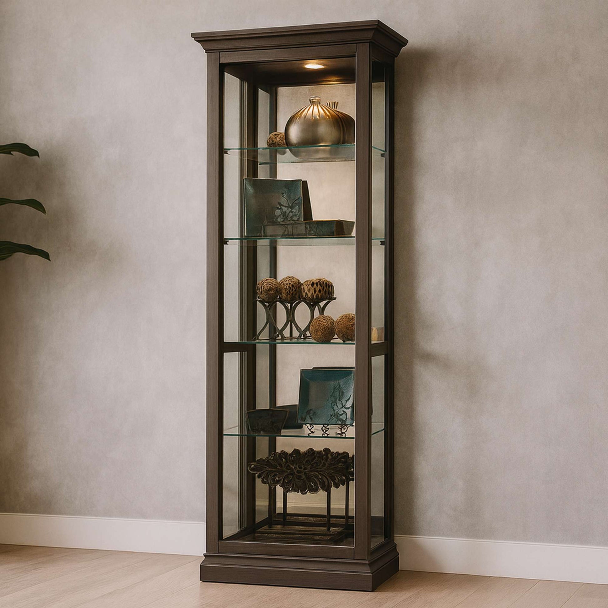 Glass display cabinet with decorative items and plants